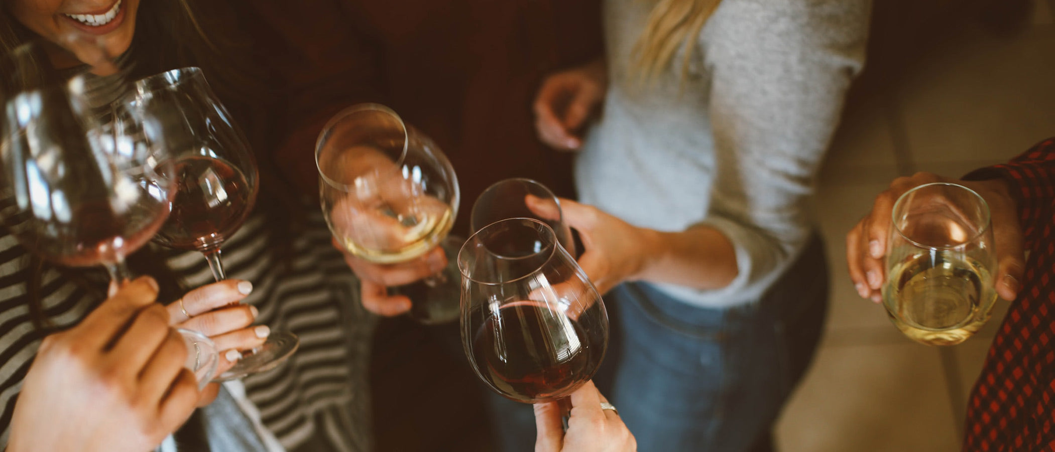 Group of women clinking glasses