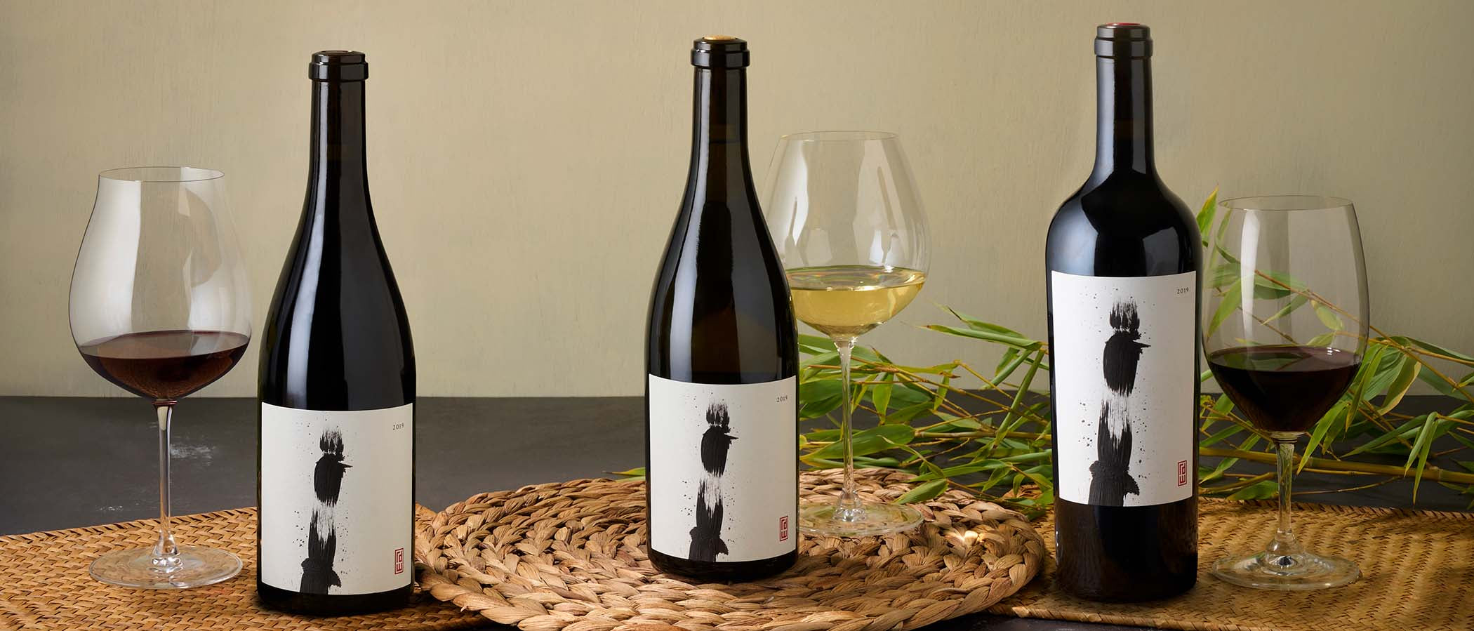 3 bottles of Khoai wine on a table