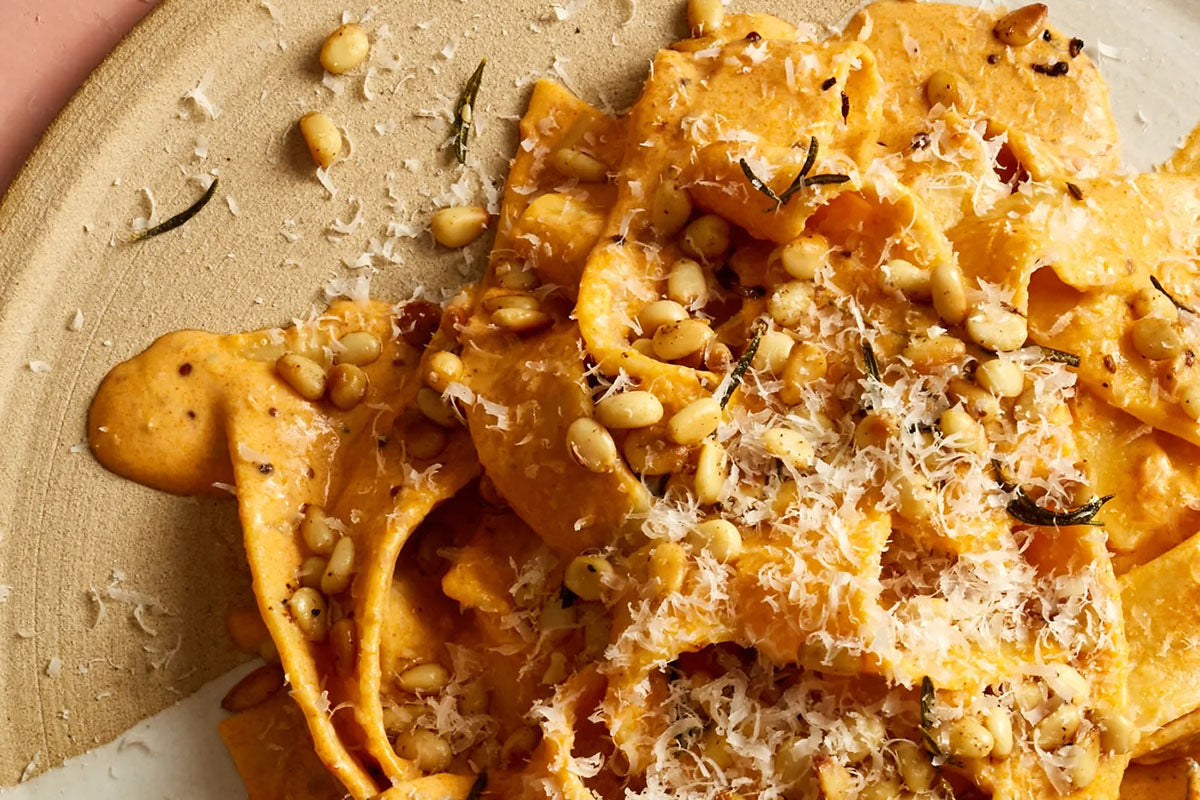 Pink sauce pasta on a beige plate