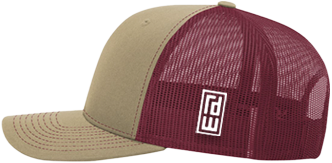 A two-tone trucker cap with a tan front panel and brim, and a burgundy mesh back, featuring a white square logo patch on the side.