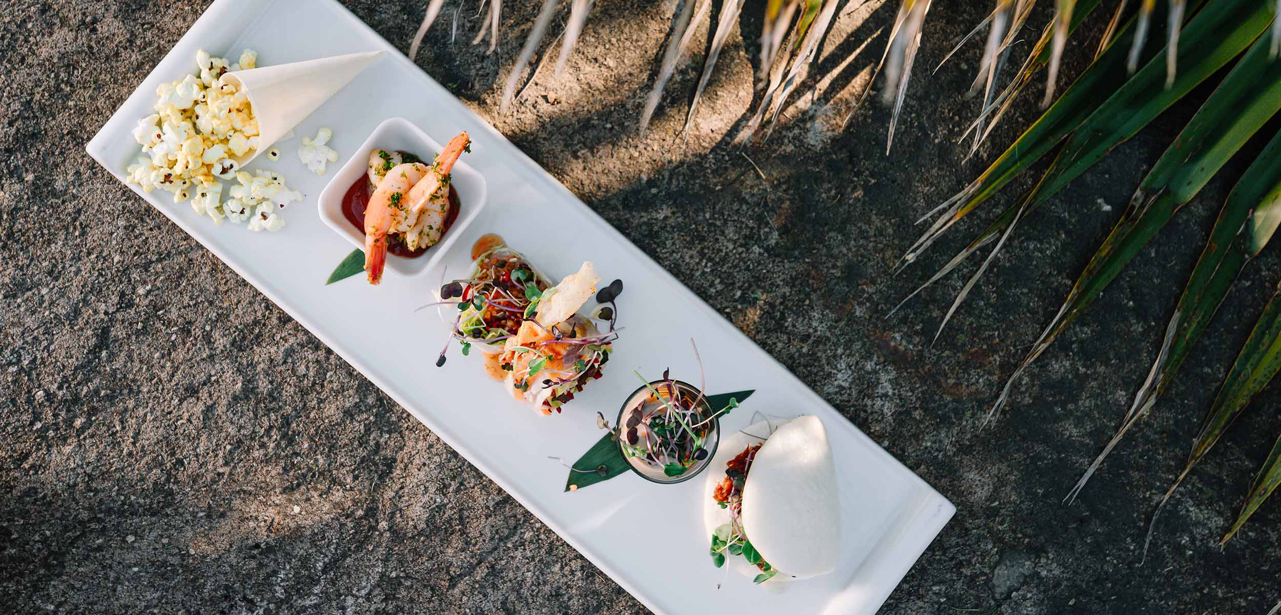A plate of Asian dishes to pair that wine