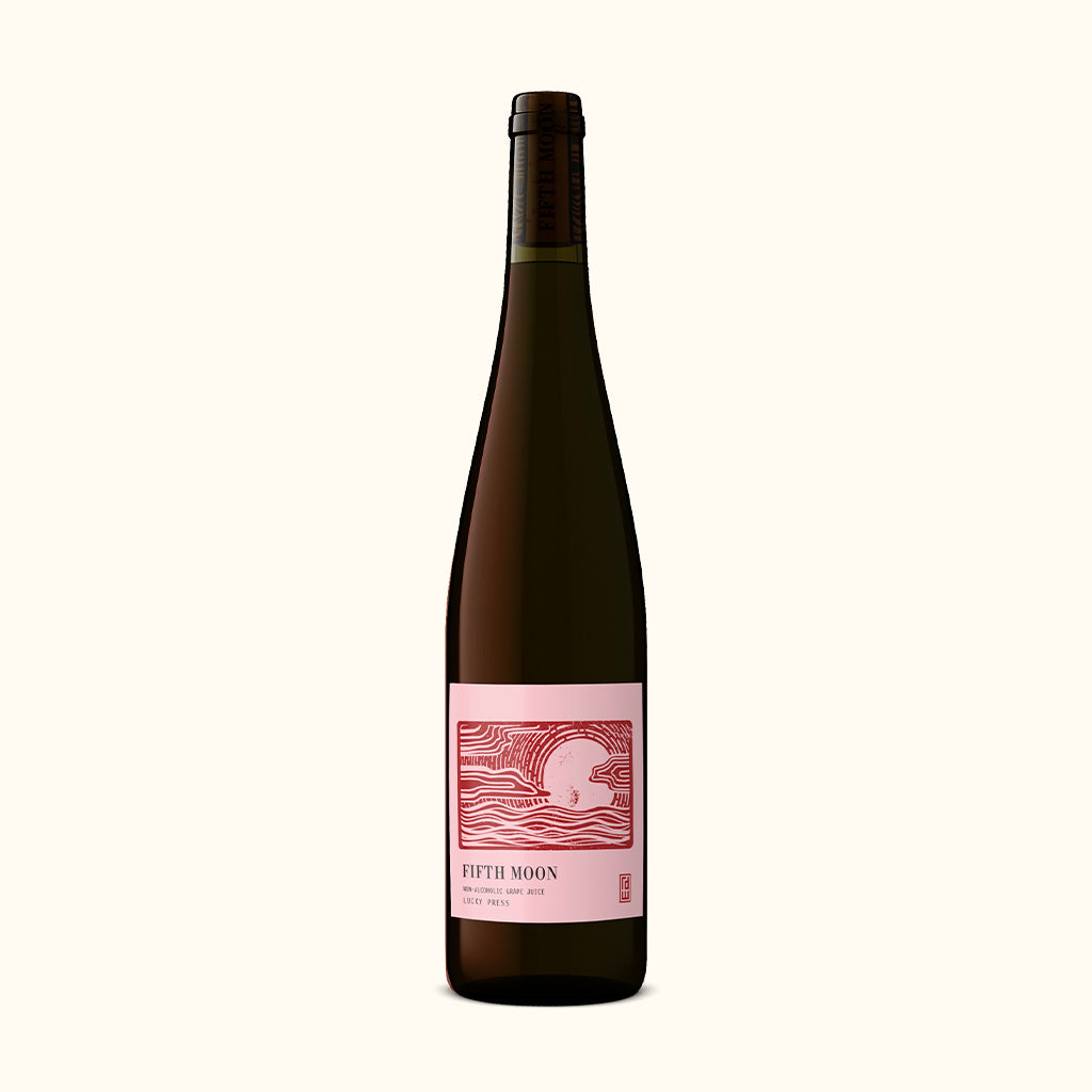 a bottle of fifth moon lucky press grape juice
