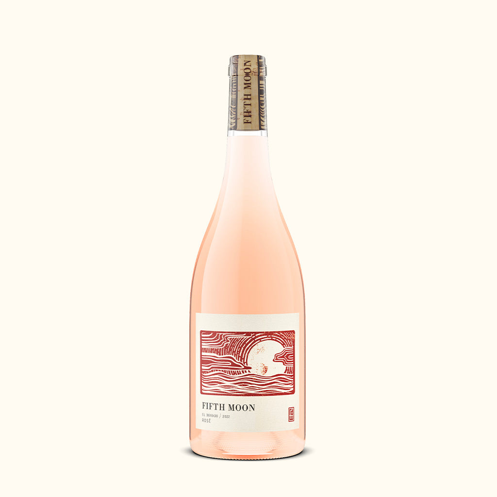 A bottle of Fifth Moon Rosé Pink wine with a pale pink liquid