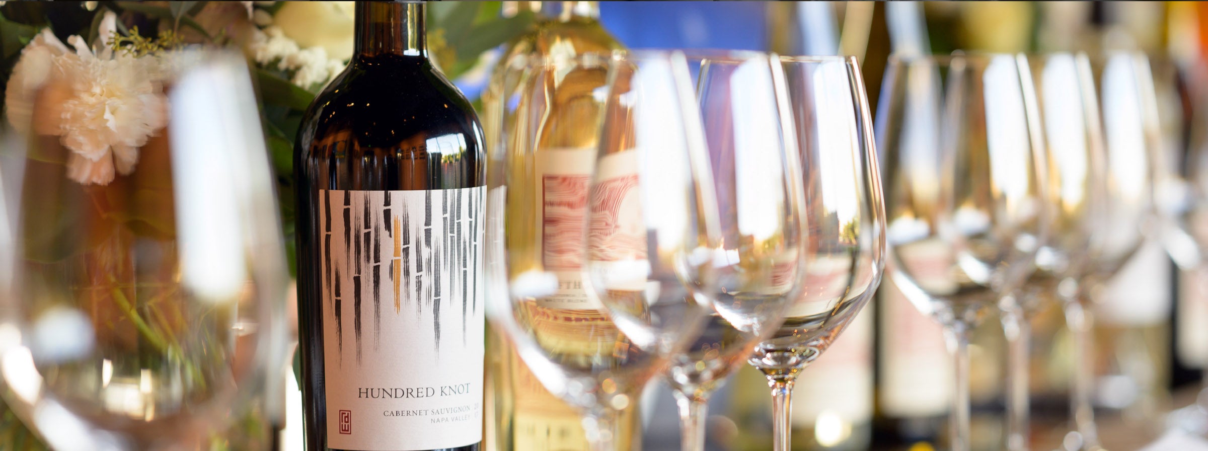 Glasses of Napa Valley wine on a sunlit table at RD Winery