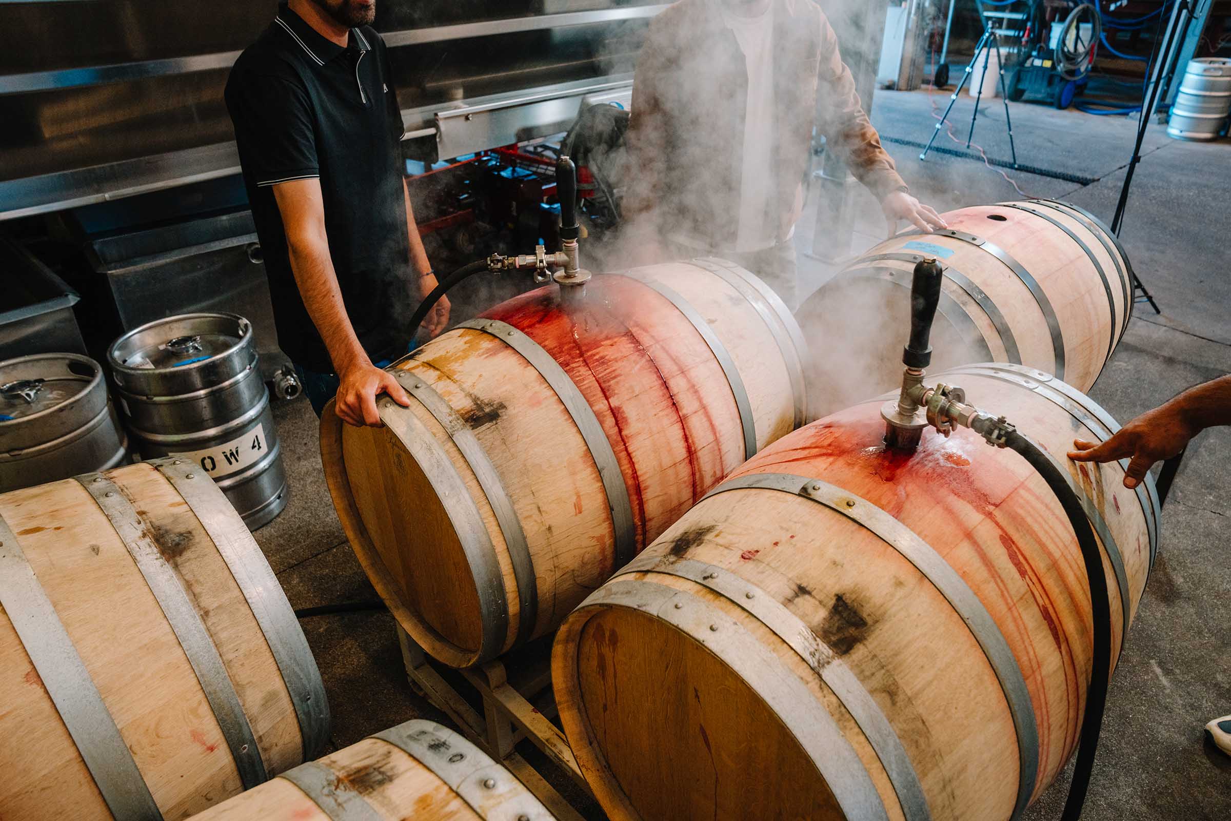 Winemaker topping barrels in the RD Winery cellar