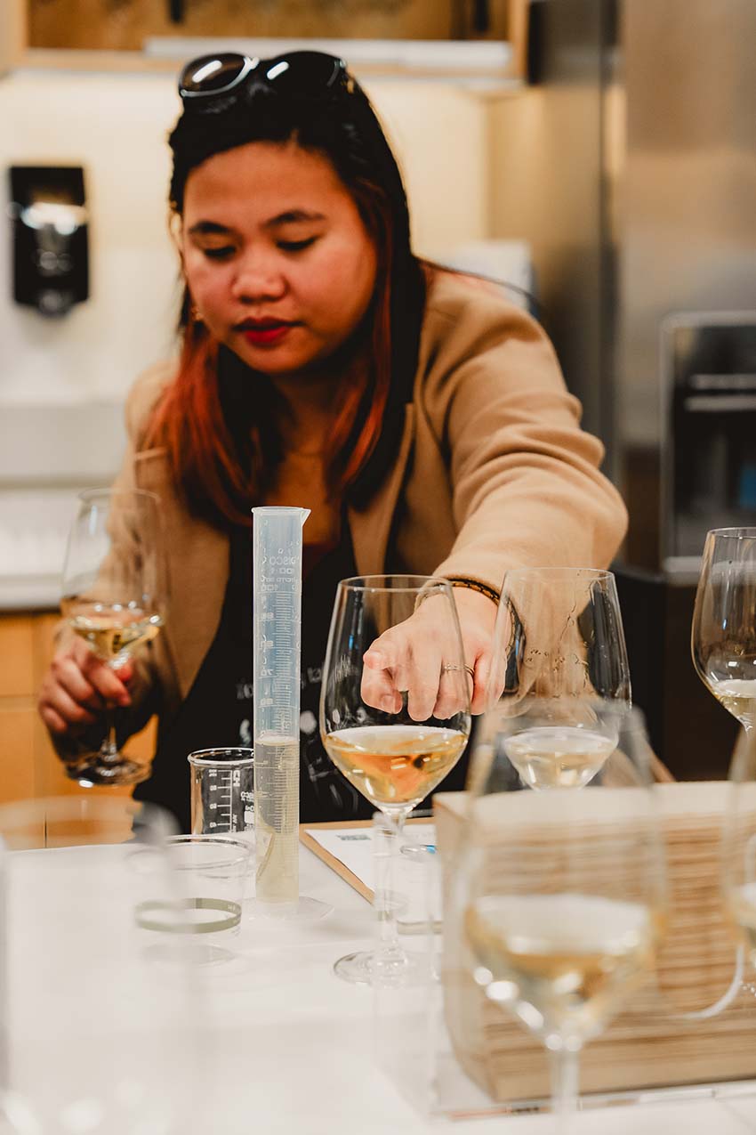 Woman pointing to a wine glass