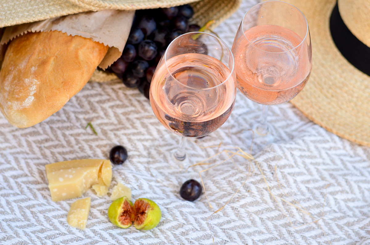 A relaxing summer picnic with two glasses of rosé