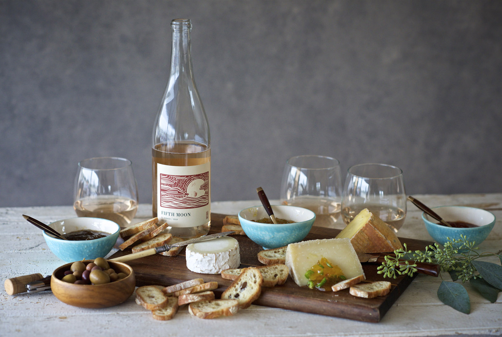 Cheese plate and bottle of rosé