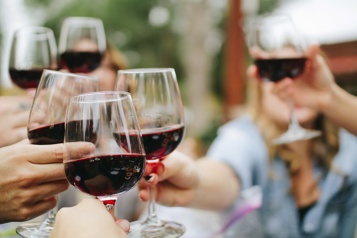 Group clinking wine glasses