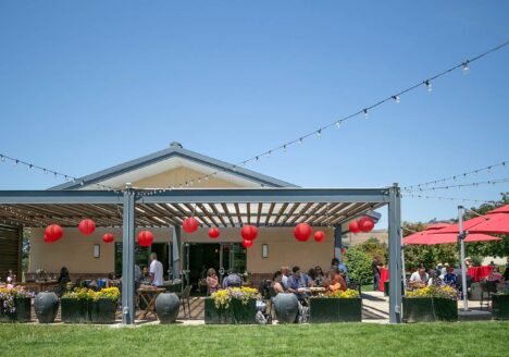 Festival guests on the patio enjoy the celebration.