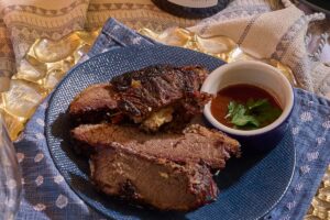 Beef brisket on a blue plate