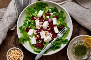 Roasted beet and feta salad on a table.