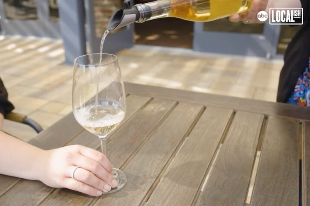 White wine being poured into a glass