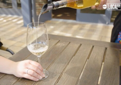 White wine being poured into a glass