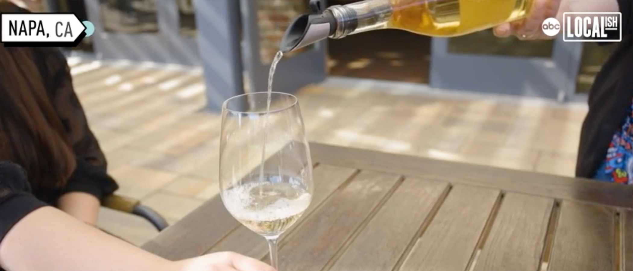 White wine being poured into a glass