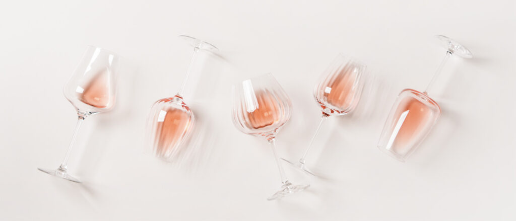 rose glasses laying on a cream background