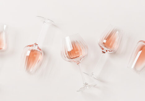 rose glasses laying on a cream background