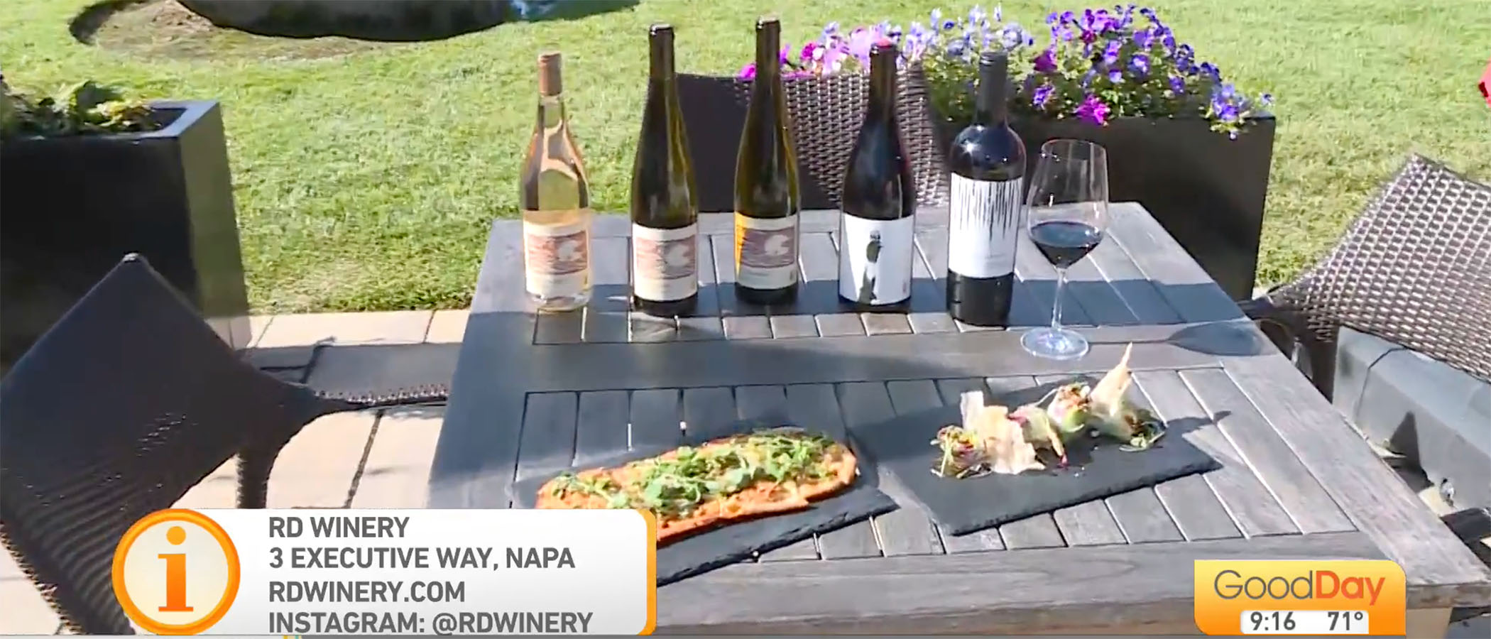 Wine bottles and Asian dishes on outdoor table