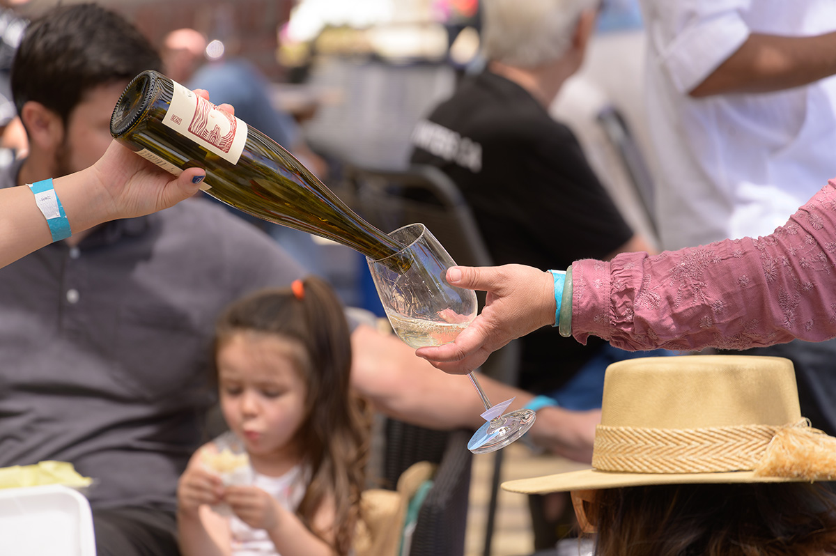 Guest receiving a glass of white white