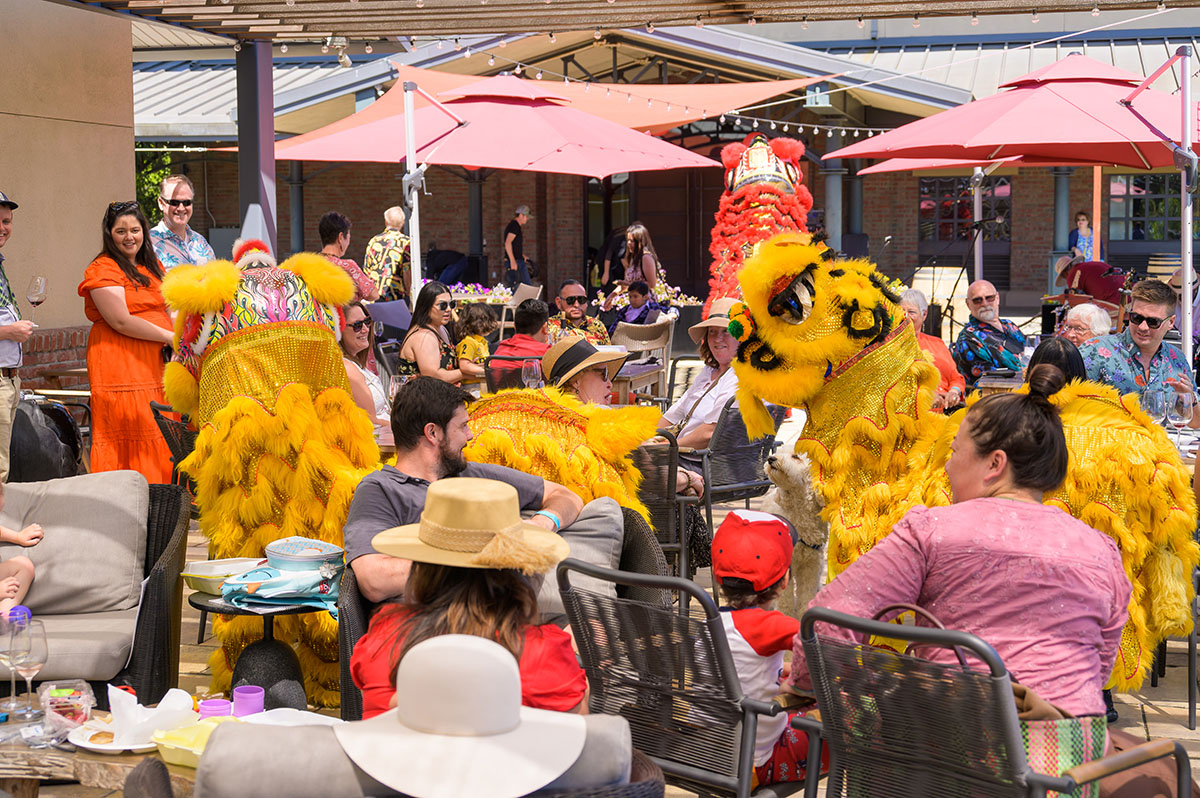 Yellow dragons dancing through the crowd on the patio