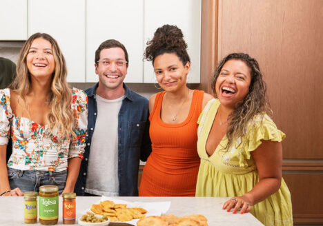 Five people in front of kitchen counter