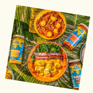 Overhead shot of colorful Filipino food and Fila Manila sauces
