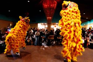 Lions performing for crowd inside tasting room